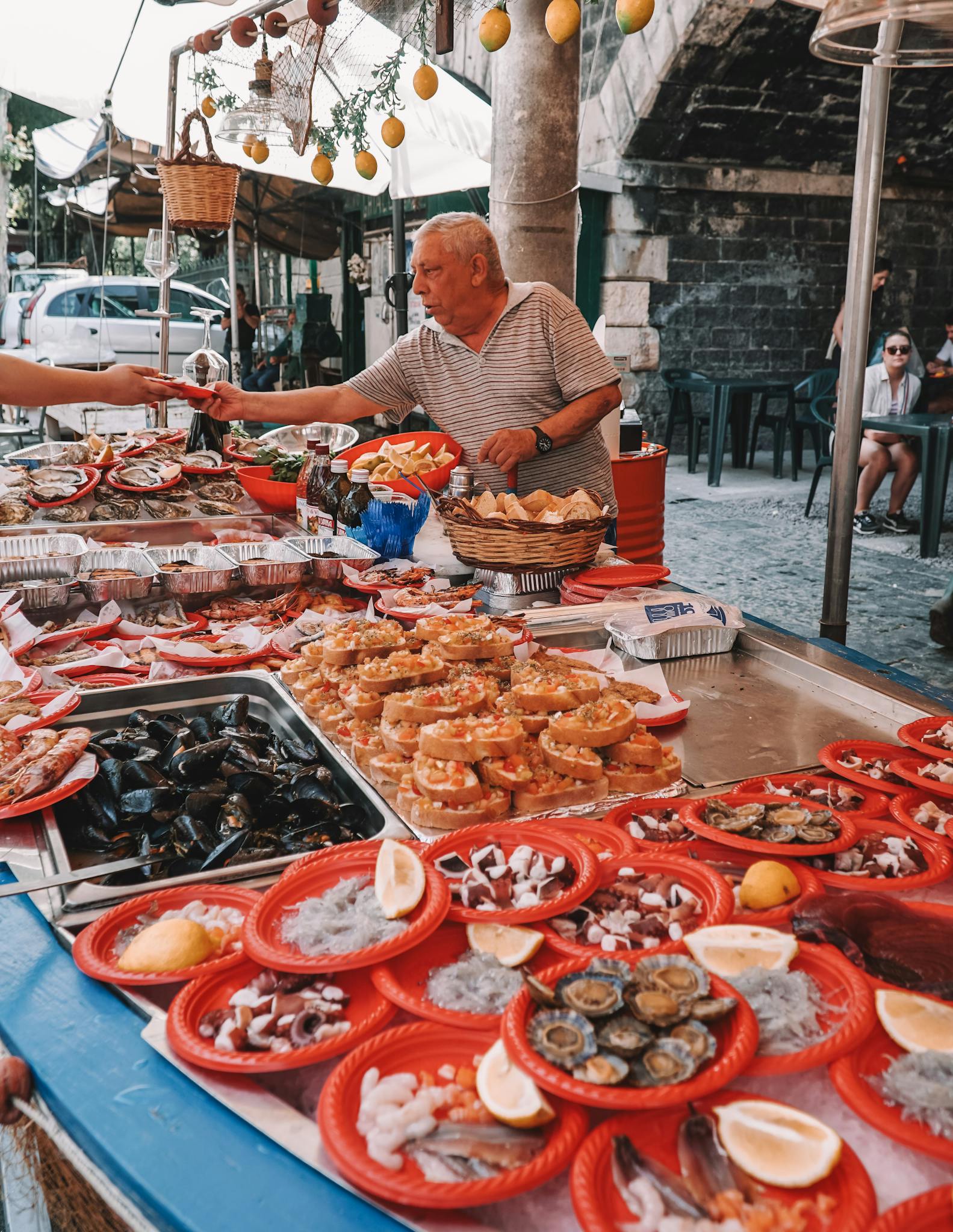 Vibrant display of seafood at a traditional Sicilian street market in Catania, Italy.